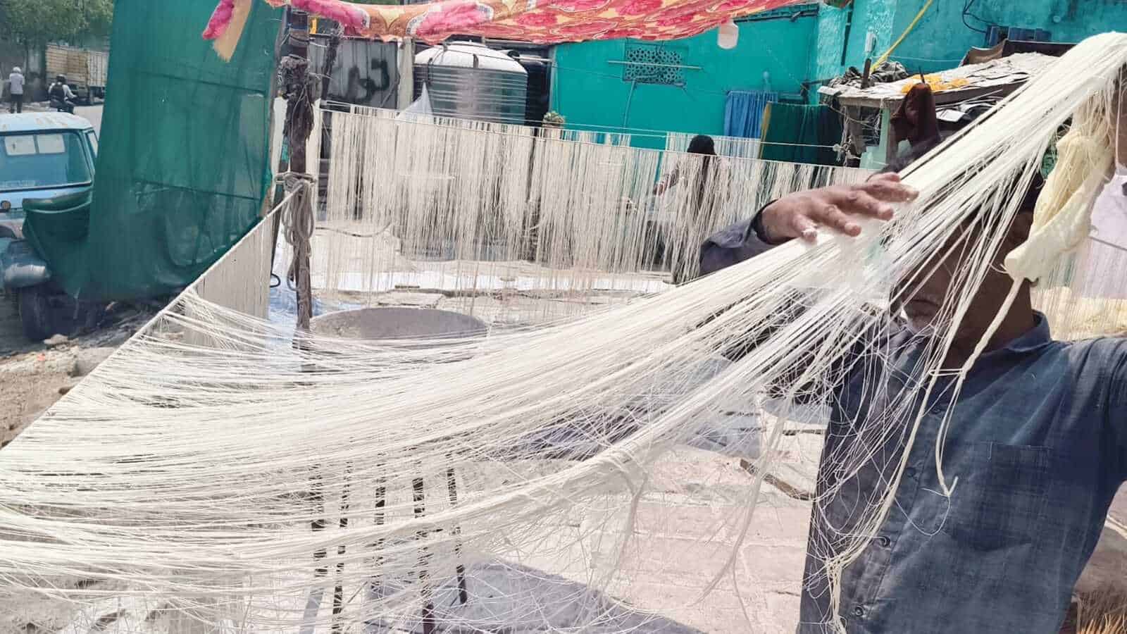 Artisan weaving handmade seviyah for Eid celebrations in Hyderabad, showcasing traditional craftsmanship.