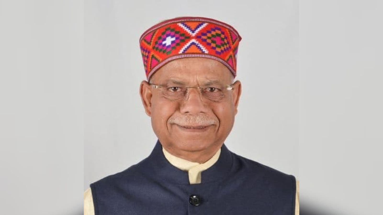 Shiv Pratap Shukla, Indian politician, wearing a colourful traditional cap and formal attire.