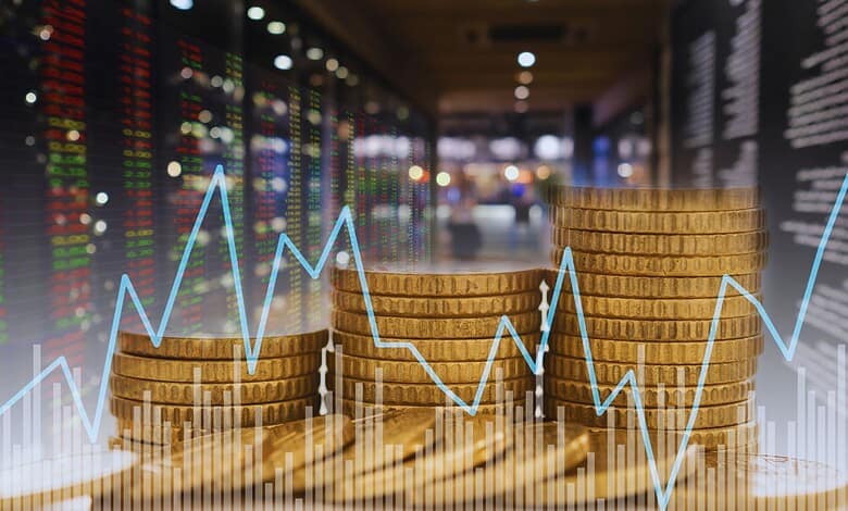 Stacked coins with stock market graph showing decline, reflecting foreign investor exit from Indian equit.