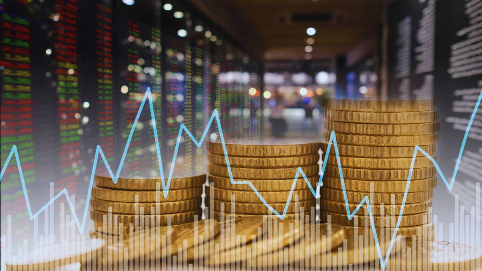 Stacked coins with stock market graph showing decline, reflecting foreign investor exit from Indian equit.