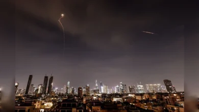 Missile interception streaks light up night sky over Tel Aviv during Iran conflict.