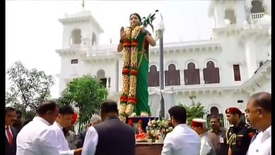 Telangana government officials and dignitaries unveil the Telangana Thalli statue at the legislature prem.
