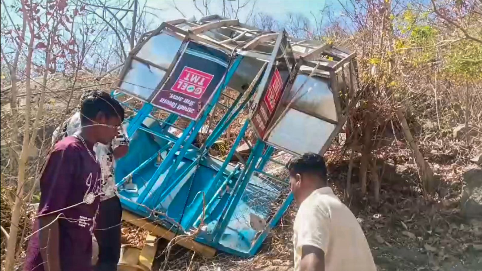 Mahasamund: People inspect a damaged ropeway trolley after an alleged crash near Khallari Mata Temple, in Mahasamund district of Chhattisgarh, Sunday, March 22, 2026. A woman was killed and seven others injured in the incident, officials said. (PTI Photo)