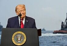 Donald Trump with a ship in the background