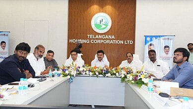 Telangana Housing officials review BHK house allocation plans in a meeting.