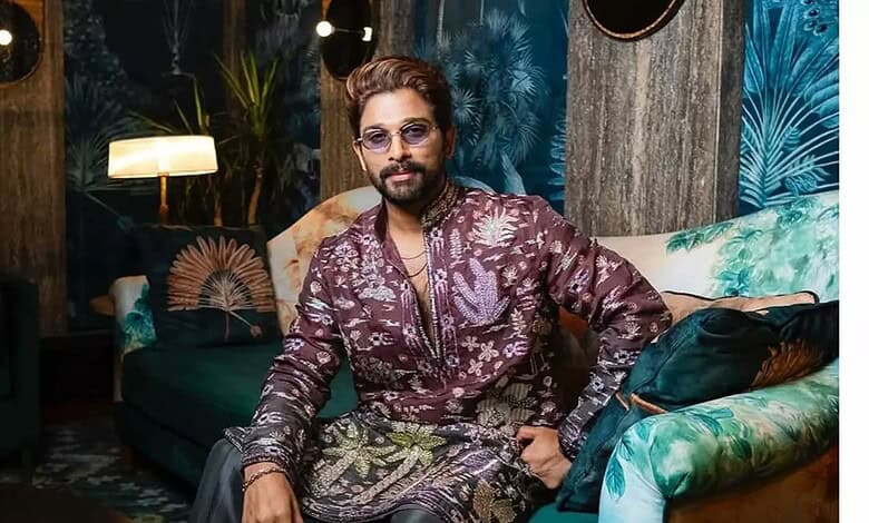 Allu Arjun attending a media event, dressed in a patterned outfit with sunglasses.