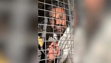 Man behind bars during social media protests in Hyderabad.