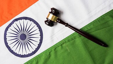 Gavel resting on Indian flag representing constitutional amendments and legal authority.