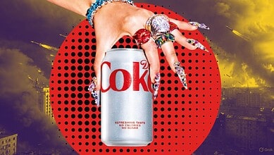 Close-up of a hand holding a Diet Coke can with colourful, decorated nails against a dramatic cityscape b.