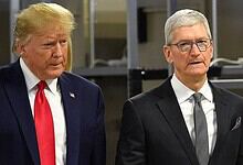 Donald Trump and Tim Cook standing together at a formal event.