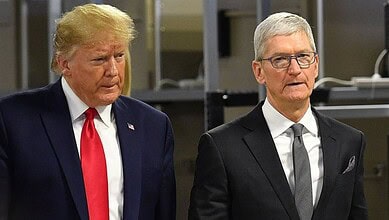 Donald Trump and Tim Cook standing together at a formal event.