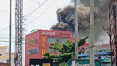 Fire erupts on Mehfil restaurant terrace in Hyderabad, thick smoke causes panic among onlookers.