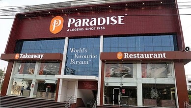 Paradise Biryani restaurant exterior with signage, showcasing its popularity and branding in India.