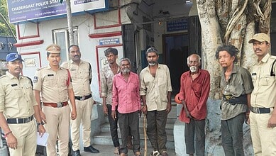 Hyderabad police rescuing five destitute men found on a footpath and taking them to a shelter.