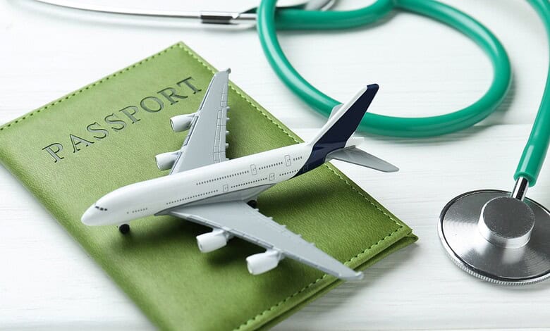 Travel and medical tourism essentials with airplane, passport, and stethoscope.