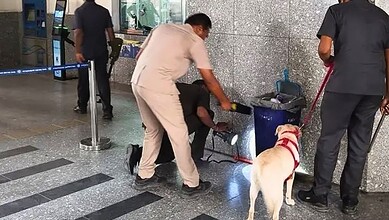 People inspecting suspicious object at Hyderabad metro station, officials and security personnel present at Uppal Metro station in Hyderabad