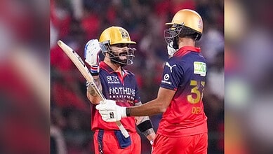 Royal Challengers Bengaluru's Devdutt Padikkal (right) celebrates his half century with Virat Kohli during the IPL match between Royal Challengers Bengaluru and Gujarat Titans, in Bengaluru, Karnataka, on Friday, April 24.