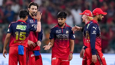 Royal Challengers Bangalore pace bowlers celebrating during IPL 2026 match against LSG.