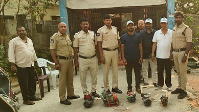 Community police officers and drone technology team pose outdoors.