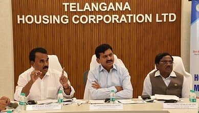 Telangana Housing Corporation LTD officials during a formal meeting at the conference room.