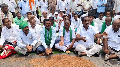 Group of farmers protesting in Adilabad demanding Telangana government to procure chickpeas.