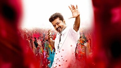 Thalapathy Vijay celebrating Holi with fans, colourful powders, joyful atmosphere, Tamil cinema star.