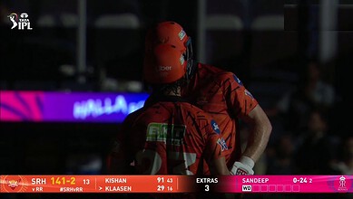 SRH vs RR cricket match at Uppal Stadium, Hyderabad, with players in action and stadium lights turned off.