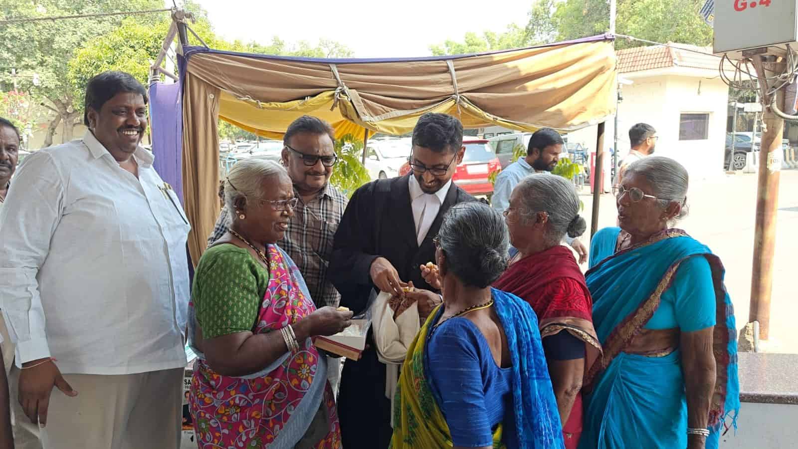 The image shows the senior citizens celebrating after they received R&R benefits for alienating their lands for the construction of Mallanna Sagar Reservoir under the Kaleshwaram Project on Tuesday, April 14, 2026.