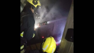 Firemen inspect the damage at the AC unit in Hyderabad