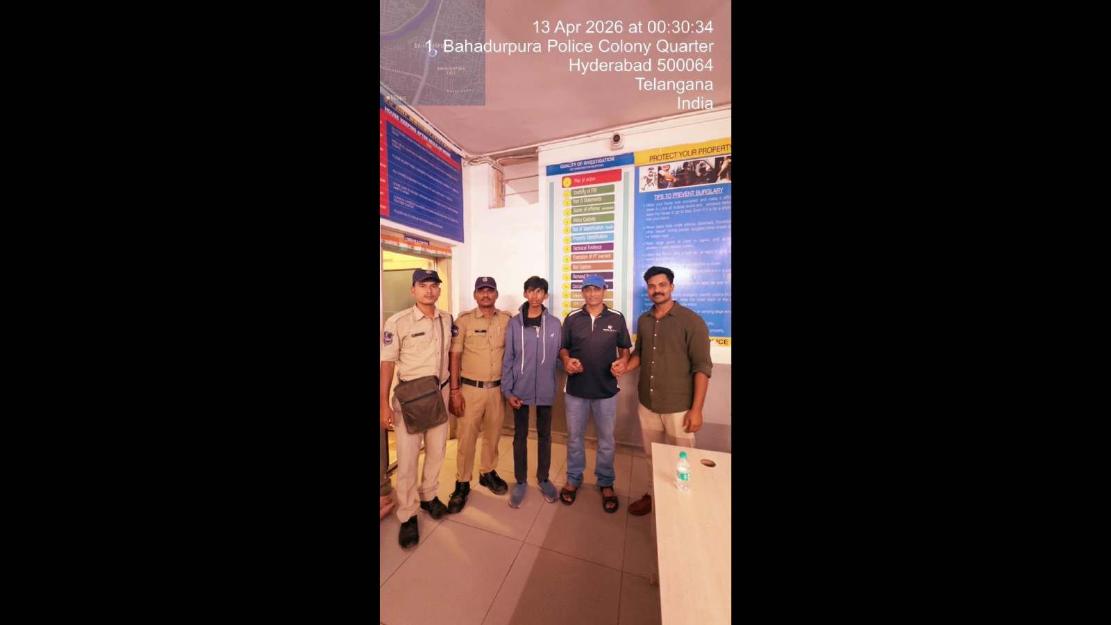 Amanulla Shareef is seen with his father and Bahadurpur police officials