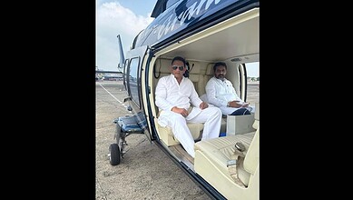 Mohammed Azharuddin sitting in a helicopter
