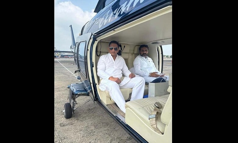 Mohammed Azharuddin sitting in a helicopter