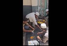 Madrasa students prepare food packets for people affected by fire