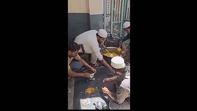 Madrasa students prepare food packets for people affected by fire