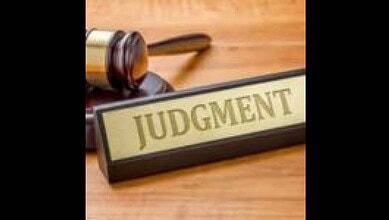 Gavel and judgment block representing legal decision-making, symbolising justice and court rulings.