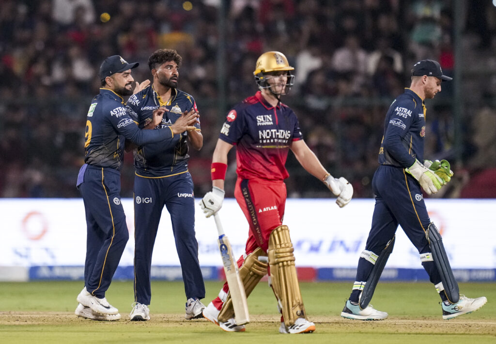 Virat Kohli and Devdutt Padikkal celebrate after a successful cricket shot during IPL 2026 match.