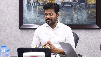 Man in white shirt during meeting about Kaleshwaram project investigation.