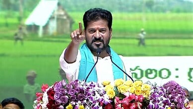 Telangana Chief Minister speaking passionately at a political rally, addressing a Congress leader.
