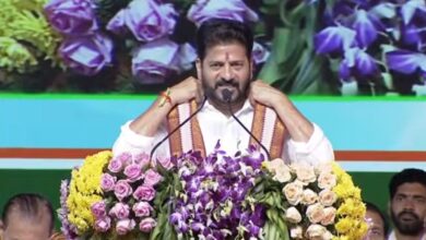 The image shows Telangana CM A Revanth Reddy speaking at a public meeting held in Pipri village of Adilabad district on Monday, April 6, 2026.