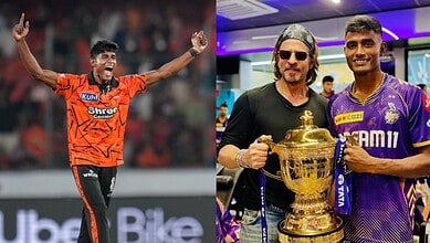 Cricket player celebrating with arms raised after a match win, wearing an orange jersey.