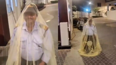 Security guard wears mosquito net