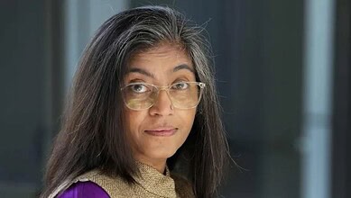 Women journalist with glasses in a professional setting at The Siasat Daily office.