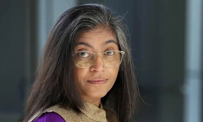 Women journalist with glasses in a professional setting at The Siasat Daily office.