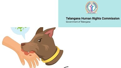 Dog attacking a person, raising awareness about stray dog attacks in Telangana.