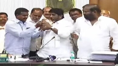 The image shows a TGSRTC JAC leader trying to put sweet in the mouth of Deputy CM Bhatti Vikramarka after the conclusion of discussions between the workers' union leaders and Telangana government at Telangana Secretariat on Friday, 2026.