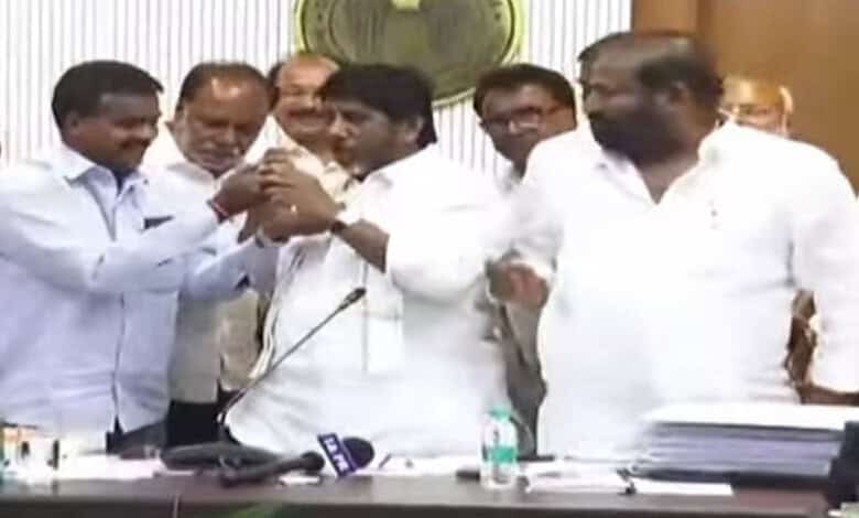 The image shows a TGSRTC JAC leader trying to put sweet in the mouth of Deputy CM Bhatti Vikramarka after the conclusion of discussions between the workers' union leaders and Telangana government at Telangana Secretariat on Friday, 2026.
