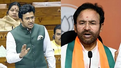 Kishan Reddy speaking during a political debate, with protests in the background.