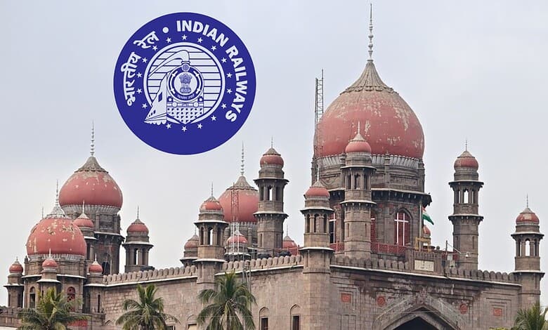Historic railway building with domes and towers, showcasing Indian architecture.