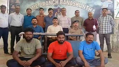 Police display seized children and suspects in trafficking case.