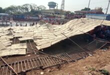 Devotees stuck under the collapsed pandal in Jagtial